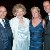 Richard and Helen Devos posing with Pamella and Dan DeVos.